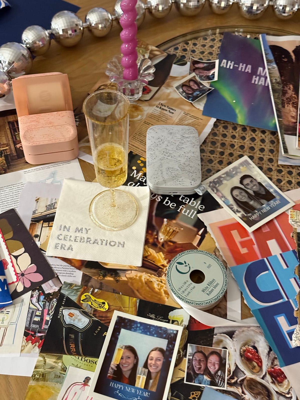 A New Year celebration vision board collage in progress