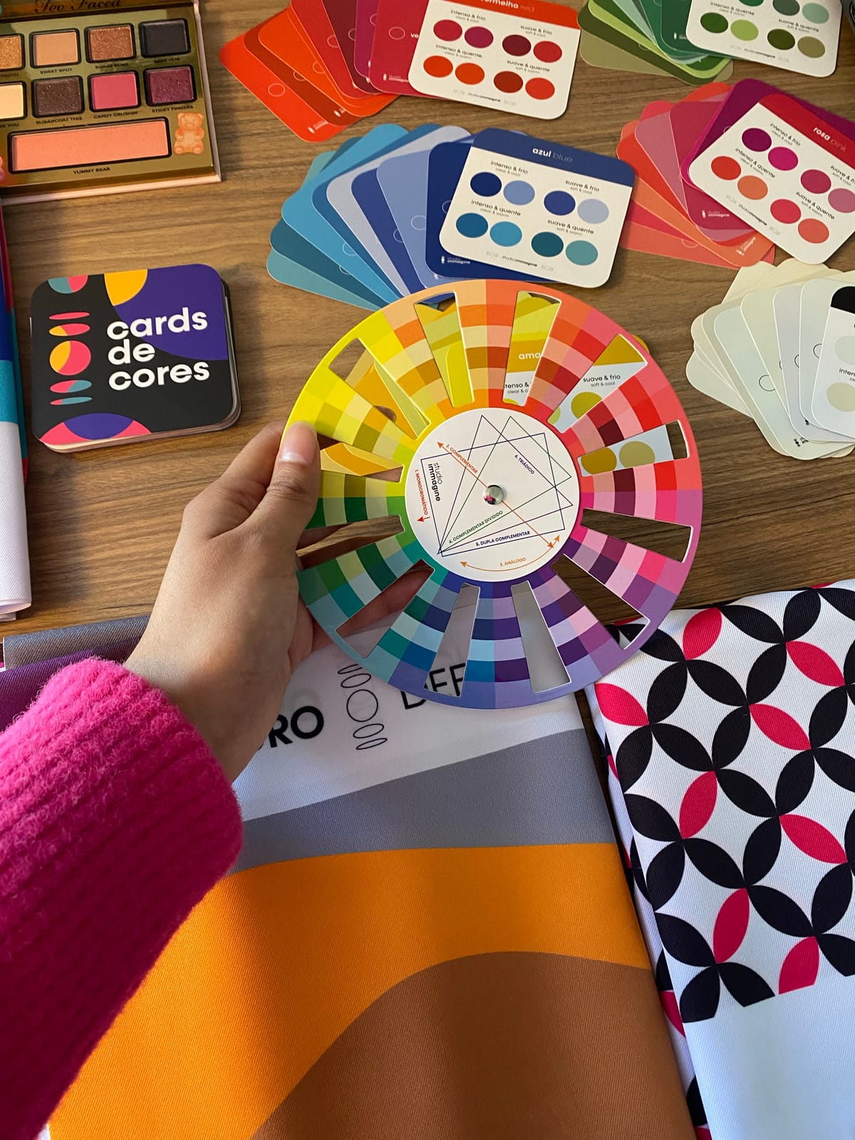 A colour-theory mood board example with a colour wheel and swatches