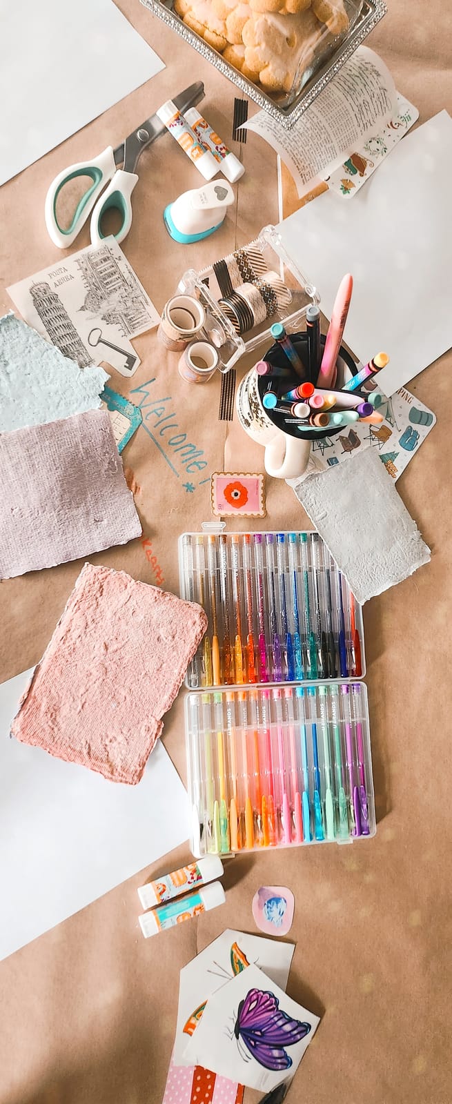 Craft supplies for a mood board — glitter pens, stickers, washi tape