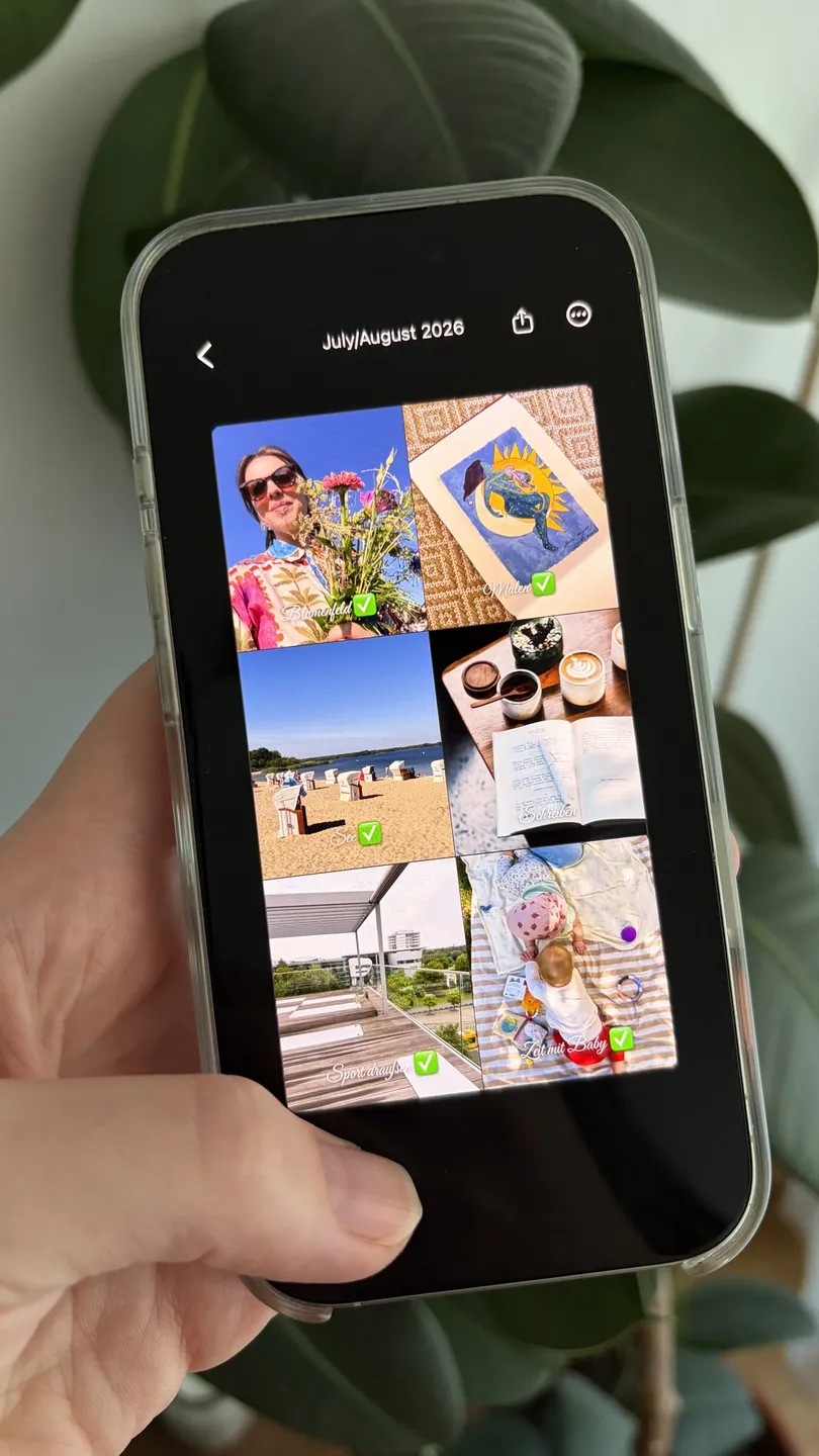 A hand holding an iPhone showing a summer bucket list of six wishes, each one ticked off, made in the Aethel app
