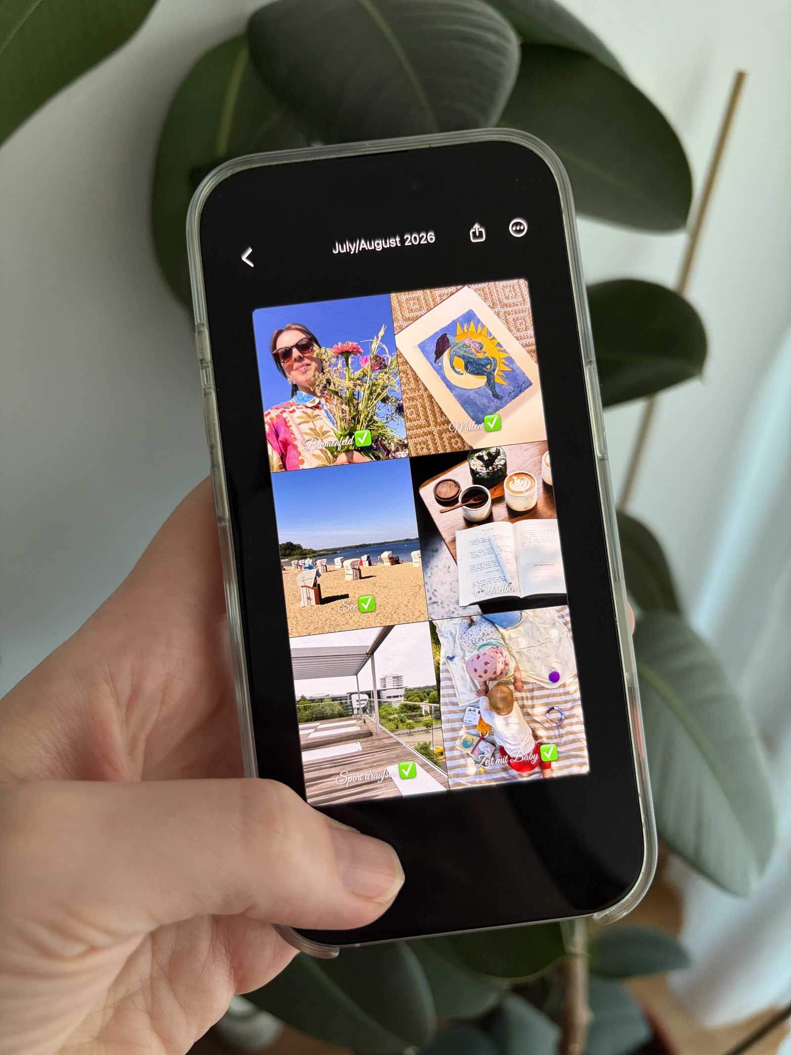 A hand holding an iPhone showing a summer bucket list of six wishes, each one ticked off, made in the Aethel app