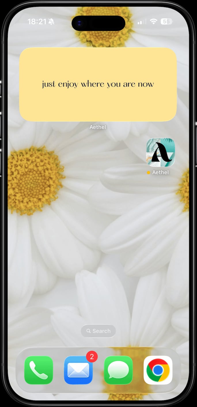 An Aethel widget on a daisy home screen showing the affirmation 'just enjoy where you are now'
