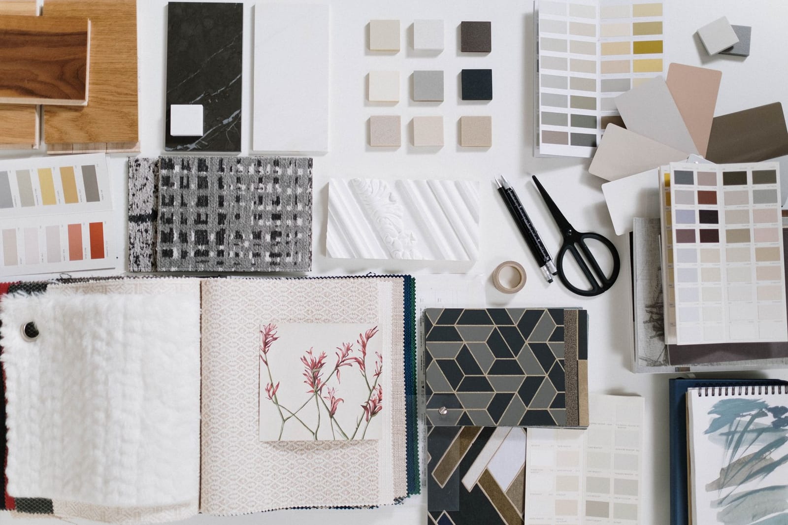 A flatlay of interior design material and colour swatches for a mood board